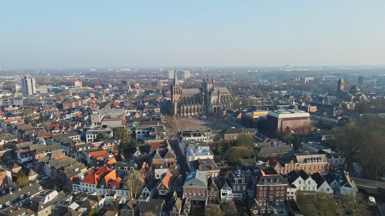 Jib up of the beautiful city center of Den Bosch, the Netherlands on a sunny day. A stunning Cathedral, the Sint-Janskathedraal, can be seen in the middle