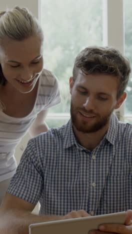 a couple is using tablet computer