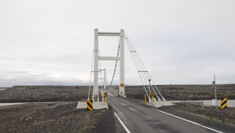 small bridge in rural iceland with gimbal video walking forward