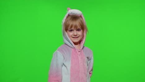 Little-child-girl-smiling,-showing-thumbs-up,-ok-gesture,-agree-sign-in-unicorn-pajama-on-chroma-key