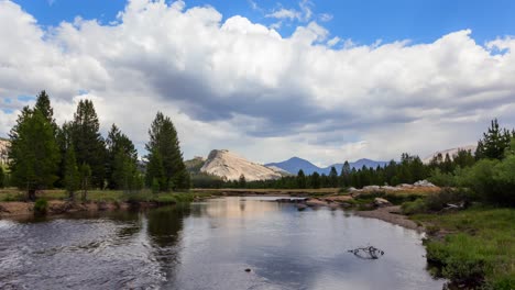 clouds over the mountain and river in tuolumne meadows in yosemite national park, united states