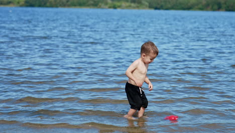 toddler playing in shallow water