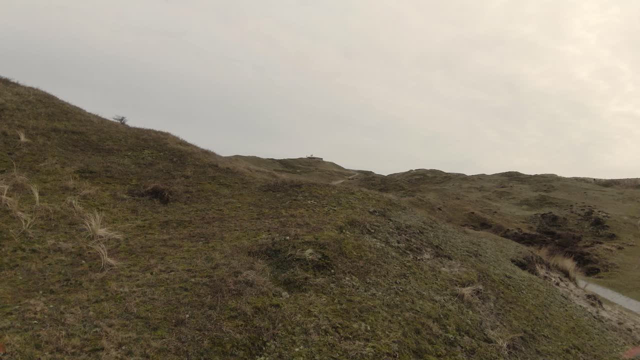 Slope Meadow Hills With Winding Road At Isle Of Texel In North Holland, Netherlands. - FPV, Drone Shots