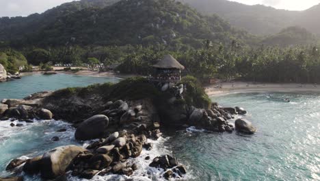 slow orbiting shot of a wooden lookout platform at the coast of cabo san juan