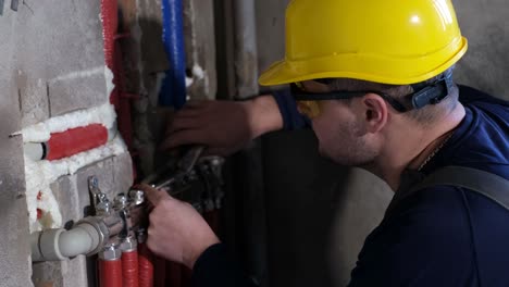 Plumber installing pipes