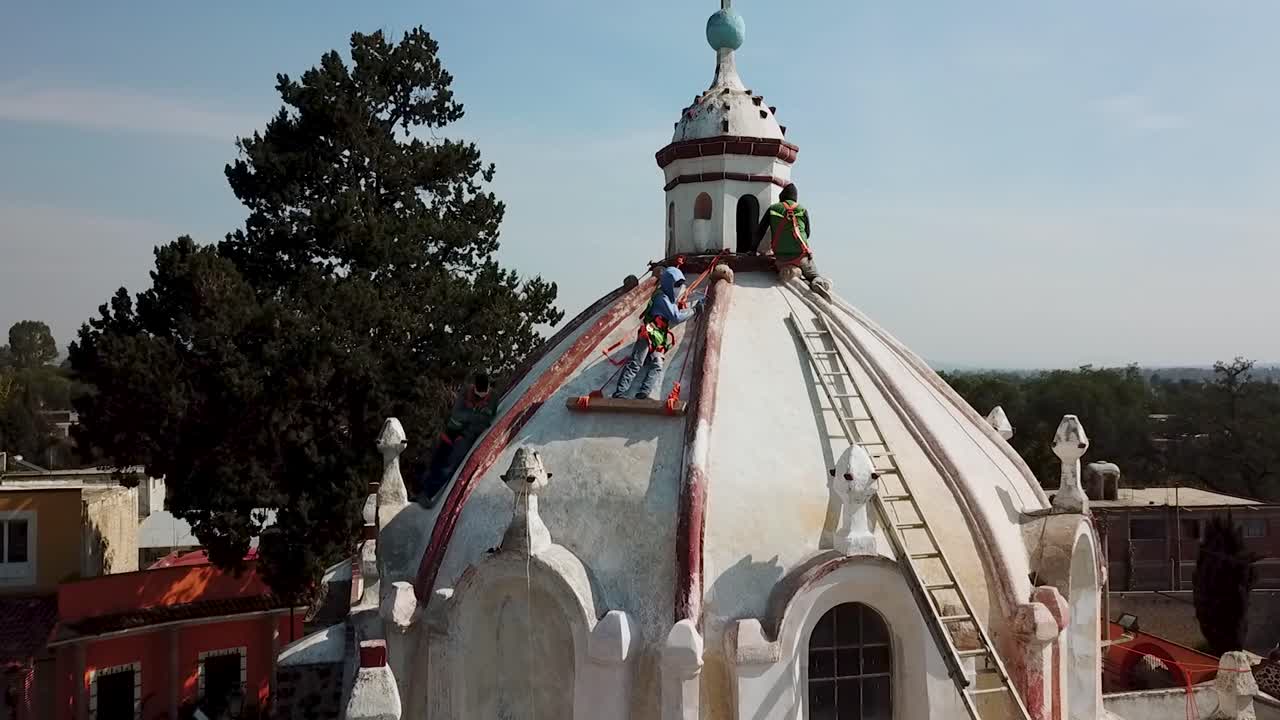 Workers Repairing the Dome of a Historic Church in Mexico