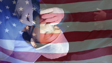 animation of flag of usa waving over surgeons in operating theatre