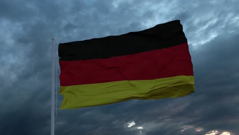 realistic flag of germany waving in the wind against deep heavy stormy sky