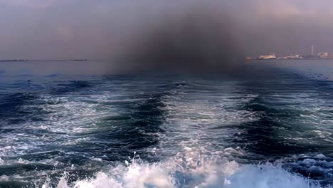 typical exhaust smoke, wake and turbulence produced by a sailing ship or ferry.