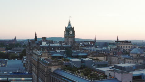 aerial shot of edinburgh at sunset, featuring a large clock tower