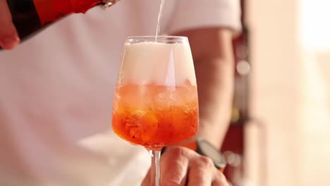 pouring an aperol spritz
