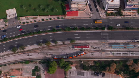 Aerial-shot-of-an-Athens-tram-arriving-at-a-stop