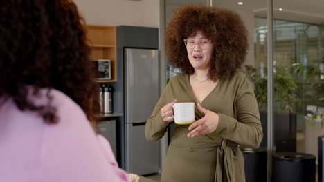 casual diverse businesswomen chatting in office, slow motion with copy space