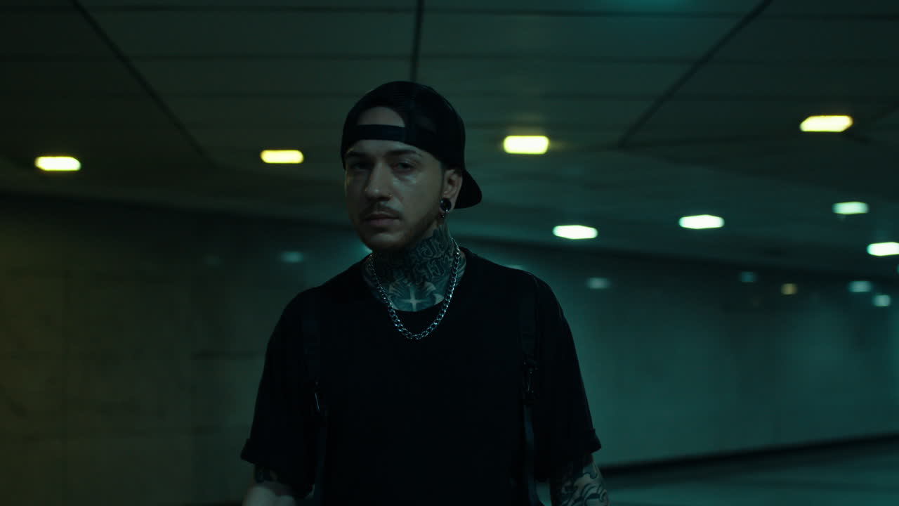 Stylish Man in Underground Passageway at Night