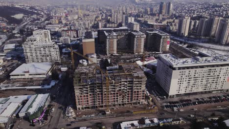 Wide-aerial-view-of-construction-site-for-a-residential-building-in-a-city