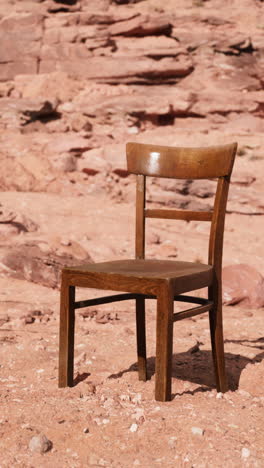 a lone wooden chair in the desert