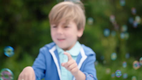 happy-little-boy-playfully-catching-soap-bubbles-floating-with-cute-child-having-fun-popping-bubbles-in-sunny-park-carefree-childhood-game-4k