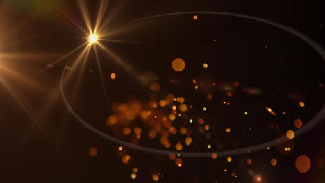 chispas de luz anaranjadas brillantes y manchas de luz contra un fondo negro