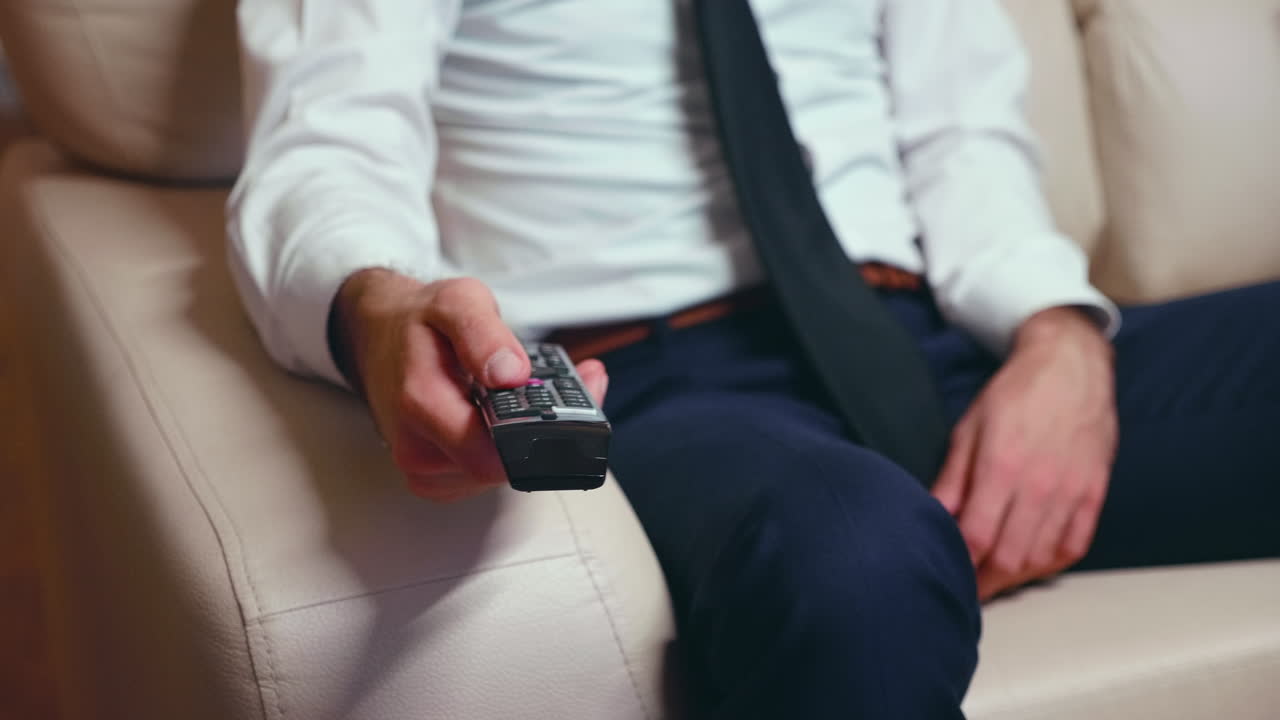 Businessman at home in formalwear and a tie