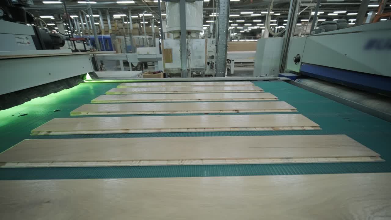 Wooden Planks Moving on a Conveyor Belt in a Factory