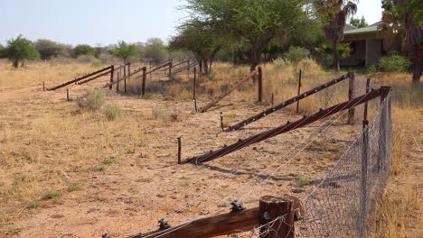 electric fences separate the tourists and lodges from the wildlife on safari in erindi namibia