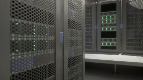 Shot-of-Corridor-in-Working-Data-Center-Full-of-Rack-Servers-and-Supercomputers