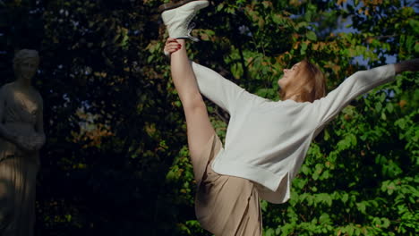 woman in a park, posing and stretching