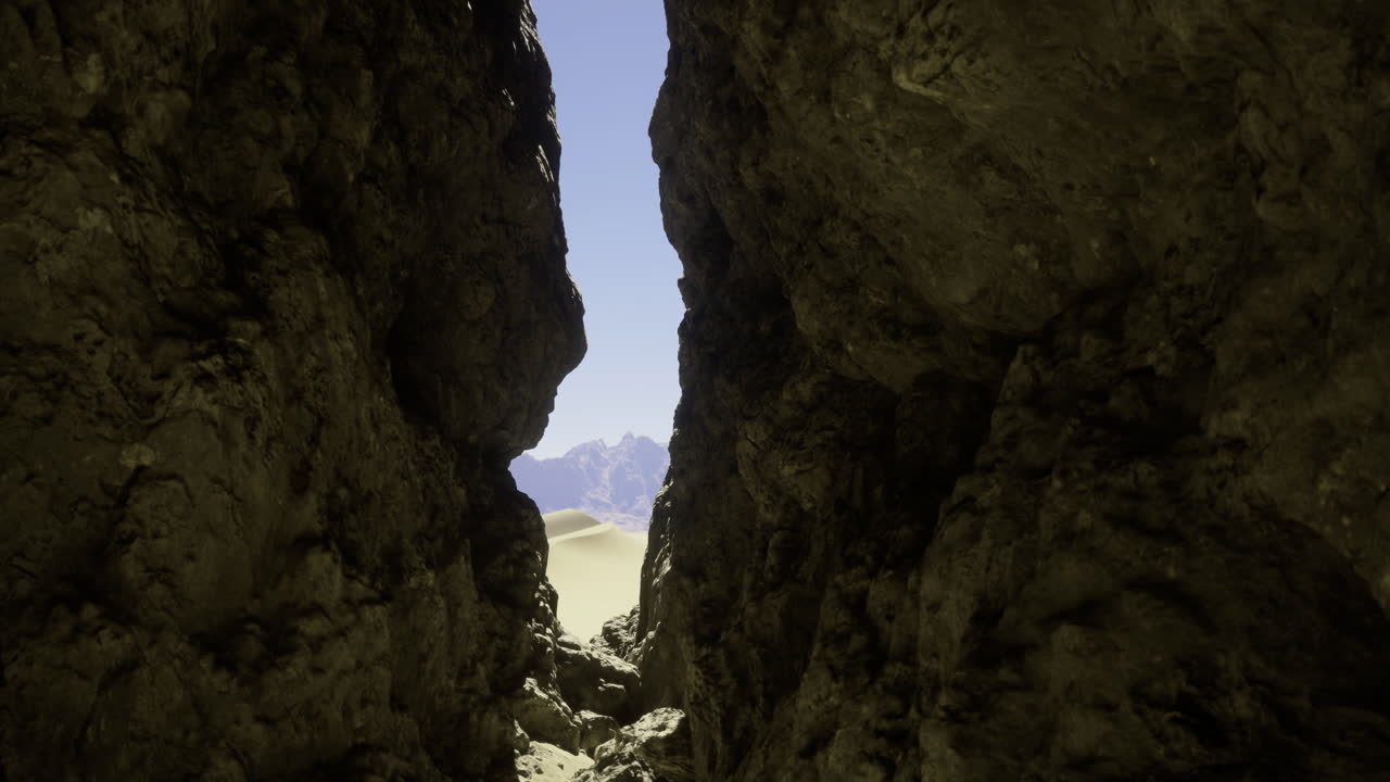 Rock formation reveals a breathtaking view of mountains and desert landscape