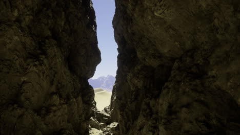 rock formation reveals a breathtaking view of mountains and desert landscape