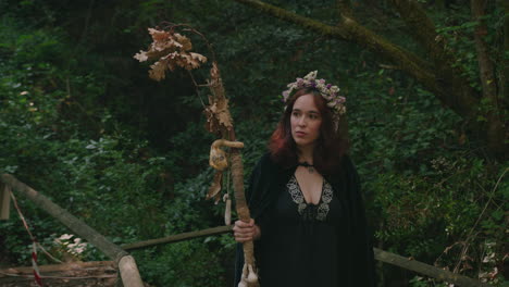 young-druid-girl-walks-in-a-forest-medium-long-shot