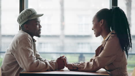 couple, happy and holding hands on table
