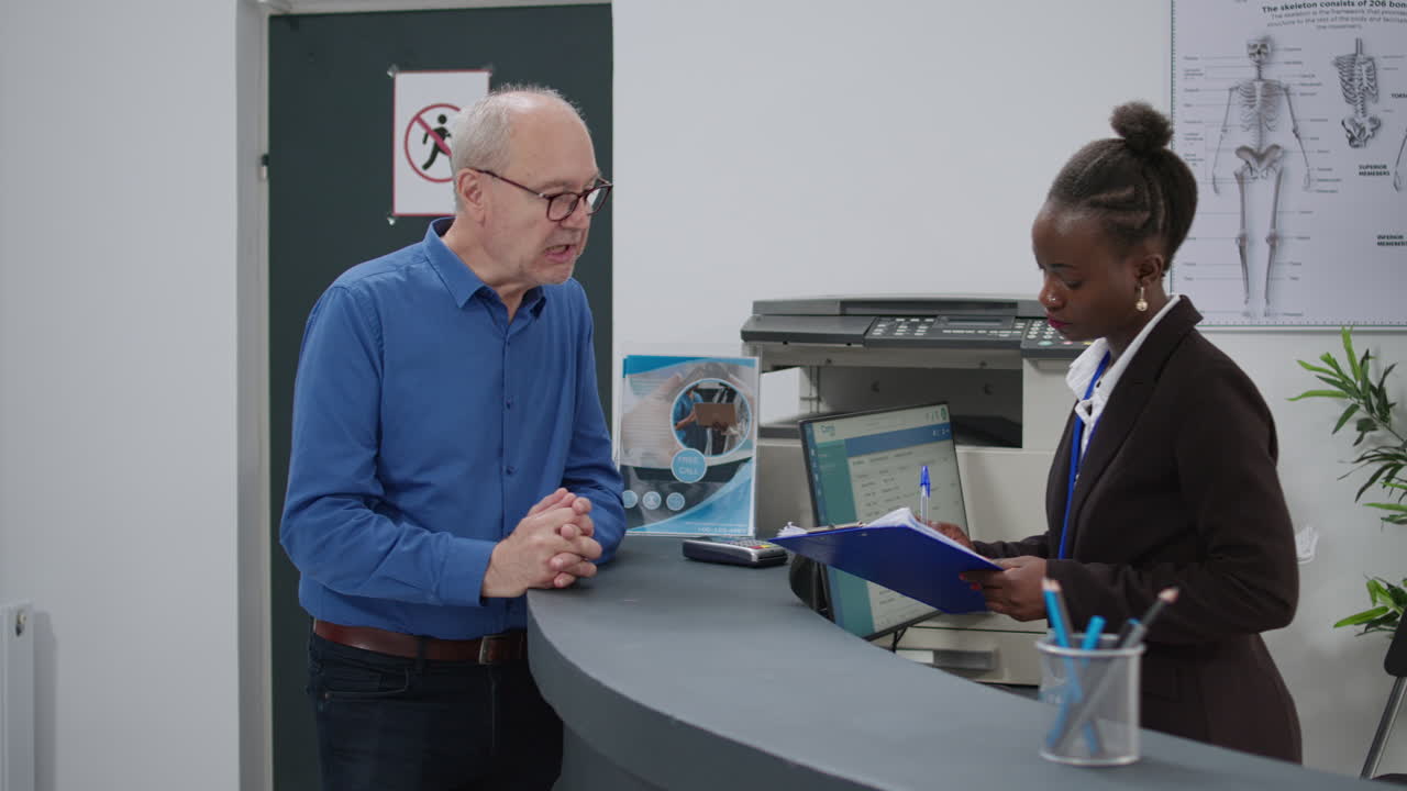 Senior man checking into doctor's office