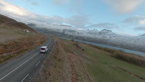 Car-drives-down-scenic-road-in-Iceland