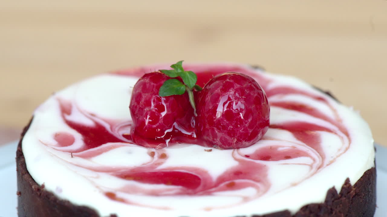 Moving chocolate cake with cherry on top