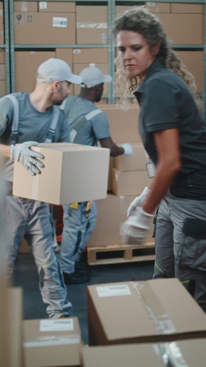 Warehouse Workers Loading and Unloading Packages for Delivery