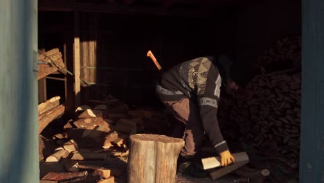 norwegian man chopping woods with an axe