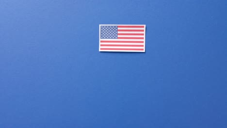 national flag of usa lying on blue background with copy space