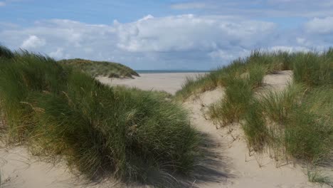 Windy-day-at-Barmouth-Beach,-Empty-Sand-Dunes-looking-towards-the-Llyn-Peninsula,-Wales,-UK-10-Second-version