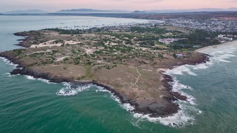 Drone-view-of-Mui-Ne-bay-headland-in-Mui-Ne,-Phan-Thiet-city,-Binh-Thuan-province,-central-Vietnam