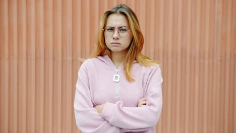 angry young woman in pink sweatshirt
