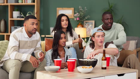 friends watching tv, drinking beer and eating popcorn