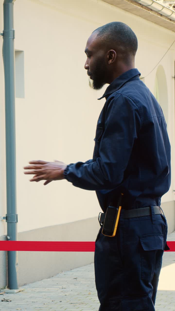 Vertical video Security guard asking people to wait
