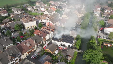 Firefighters battling a building fire in a small town