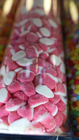 pink and white jelly candies in glass container