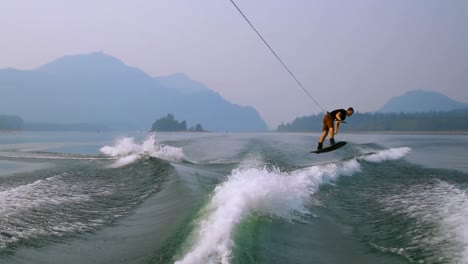 man wakeboarding in the river 4k