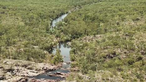 flying over australian outback, waterfall and river steam