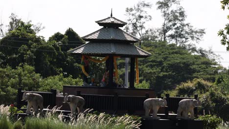 static view of elephant statues near a pavilion