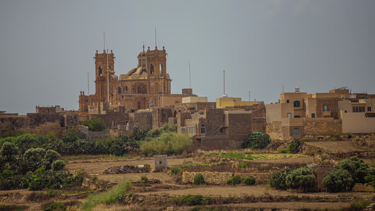 Timelapse view of Bażilika Tal-Madonna Ta' Pinu Mill near the village of Gharb on the island of Gozo