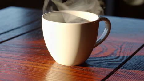 a cup of coffee with steam