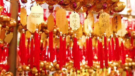 vibrant red and gold decorations sway gently